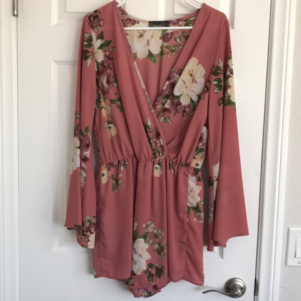 Shorts romper w/ long bell sleeve.